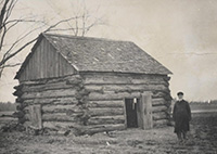 Polk County pioneer Theodore L. Hansen next to his Lincoln Twp. cabin, ca. 1876