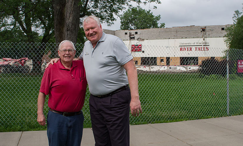 Former Assistant Director of Admissions and longtime voice of the Falcons George Hansen (left) stands with Dan McGinty in front of Karges Center during deconstruction earlier this month. 