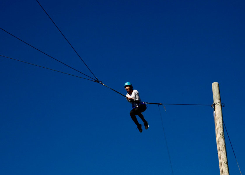 Student Traversing a Cable