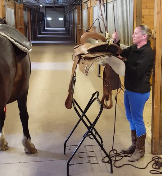 Student Prepares Saddle