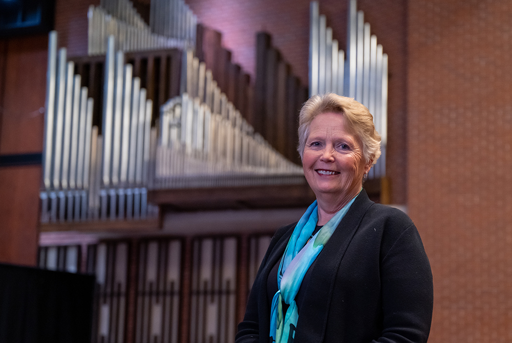 Laura Edman poses with the UWRF organ