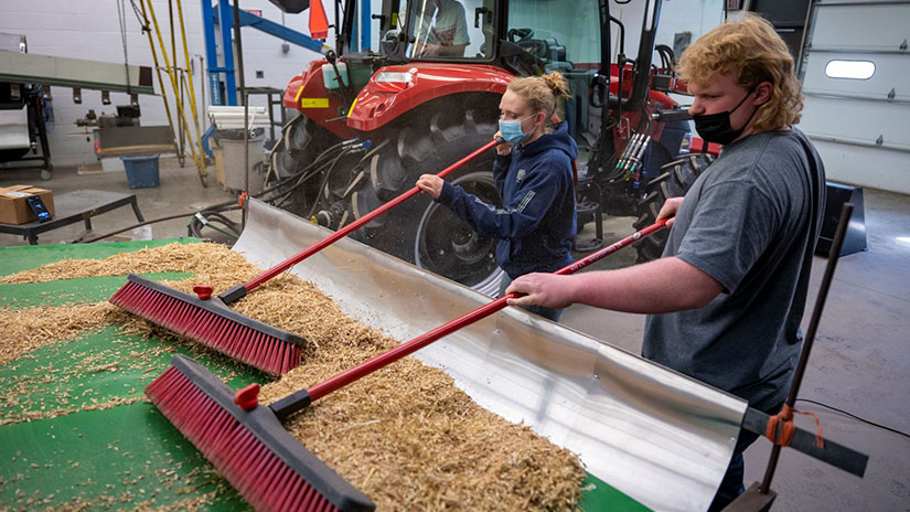 Students working on combine