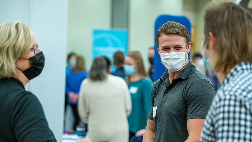 Students and employers talk at the 2021 Career Fair