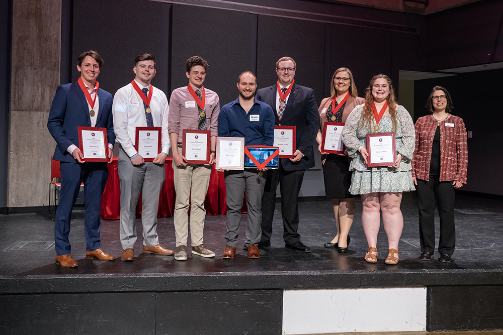 Chancellor's Award for Students award winners pose with Chancellor Gallo after accepting their awards