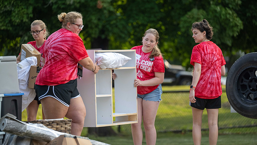 Students move furniture during UWRF's move in day on Sept. 2, 2023