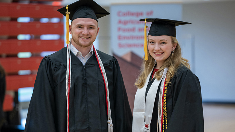 Grant Buwalda and Ashley Tuszka, outstanding CAFES seniors 2023 pose together at commencement