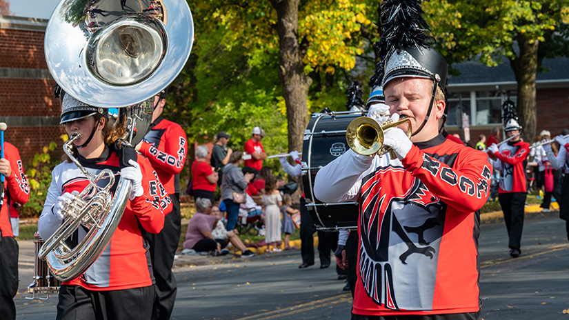 marching band players perfrom in a parade