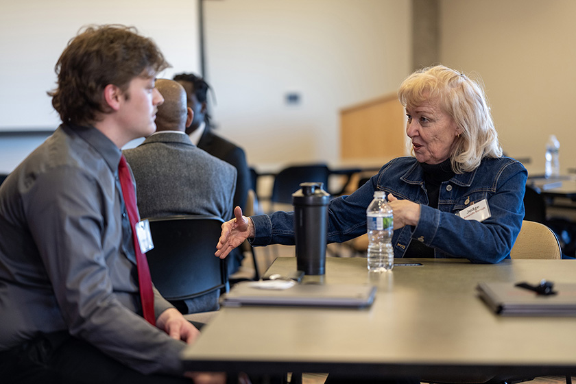 Student speaks with judge.