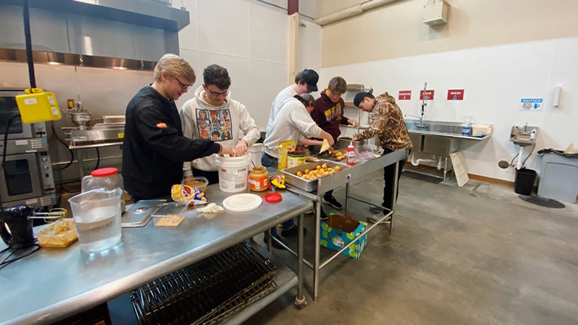 Business owners work in the food prep space in the Saint Croix Valley Business Innovation Center