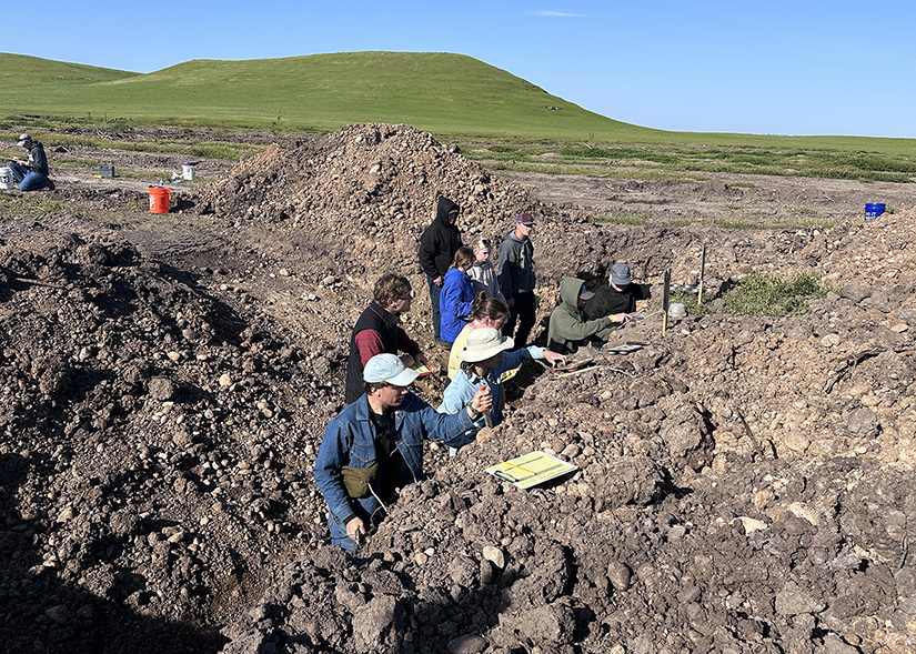 Members of the UW-River Falls Soil Judging Team work in a soil pit in Modesto, Calif., during the NACTA Student Judging Contest last month. 