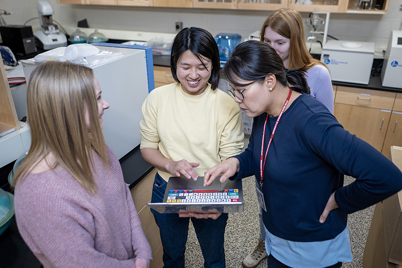Students and advisers discuss their research