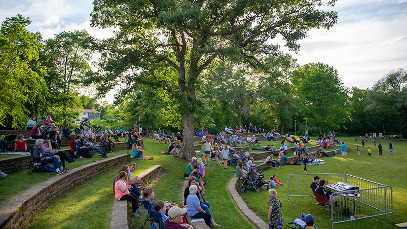 Visitors enjoy a concert at the Melvin Wall Amphitheatre stage on the UWRF campus.