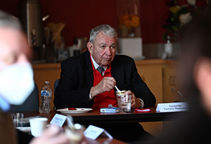 System President Thompson eating ice cream dessert