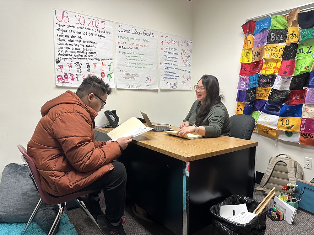 Bee Vang works with Upward Bound student