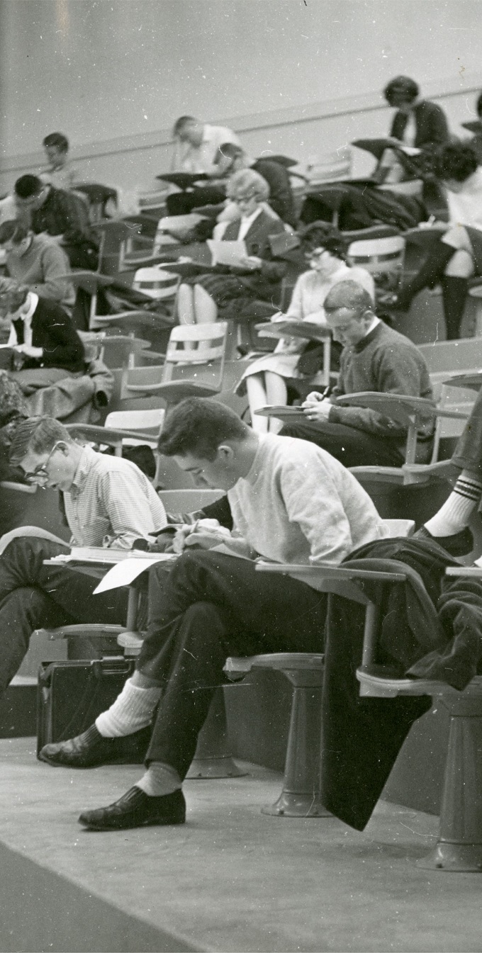 Peeking through the window at a class taking a test in one of the North Hall lecture rooms, 1966
