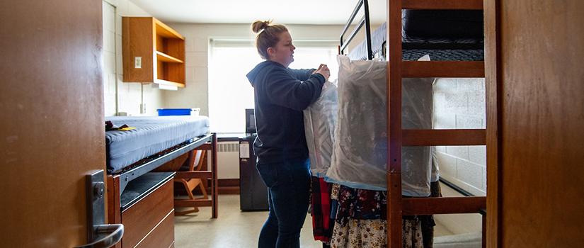 Student packs belongings