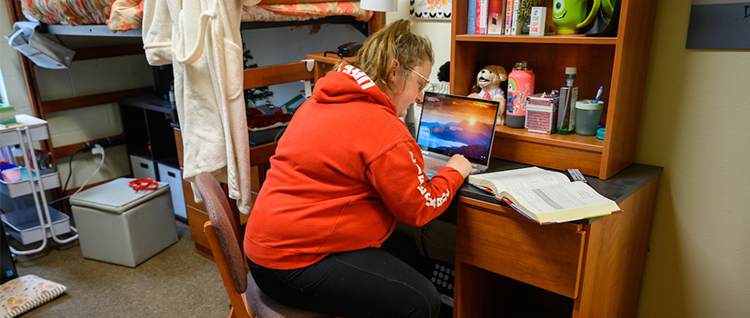 Ames bedroom, student studying at desk