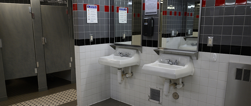 Hathorn bathroom sinks, hand dryers, and toilet stalls