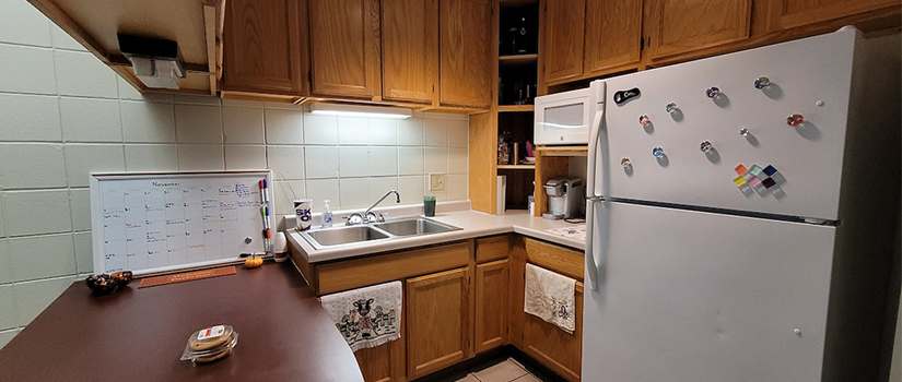 South Fork Suites kitchenette with refrigerator, sink, countertop, cupboards