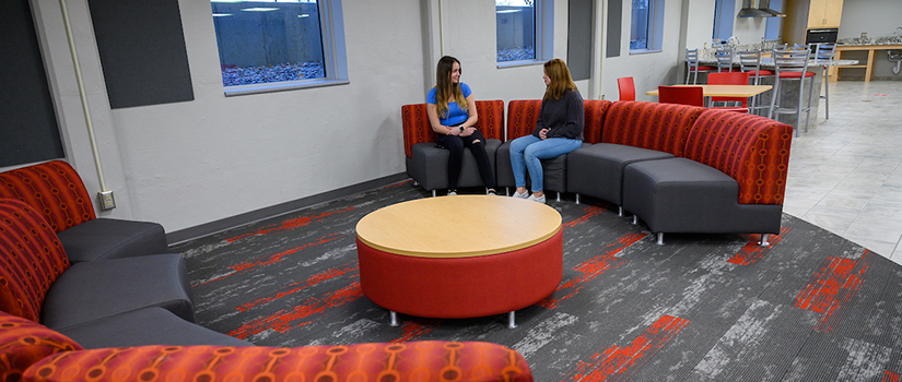 May Hall basement lounge includes seating and gaming tables