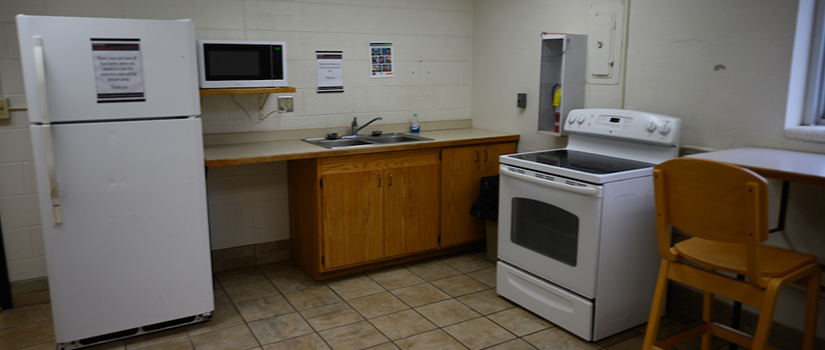 Stratton Hall kitchen includes a full-size refrigerator, stove, oven, sink, and counterspace.