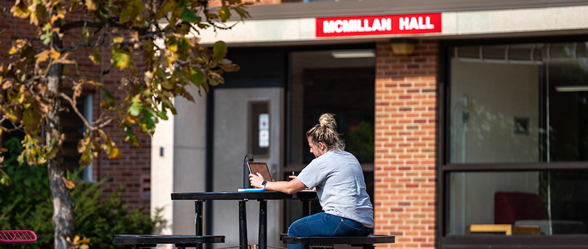 Student studies outside residence hall