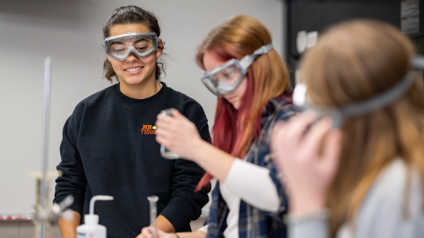 Photo of student with science goggles on smiling