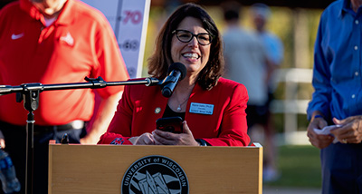 Chancellor Maria Gallo speaks behind a podium