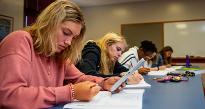 Group of students taking a test in a classroom