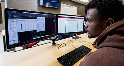 Engineering Technology student working on a project in a CAD lab