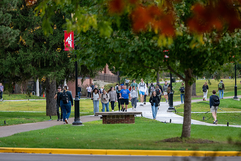 students walk across the UW-River Falls campus