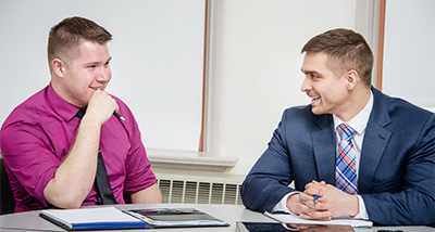 Two students talking in a Finance class