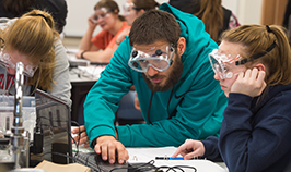 Students completing a science experiment in chemistry lab