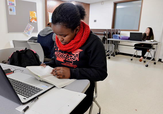 Education student takes notes during a study session