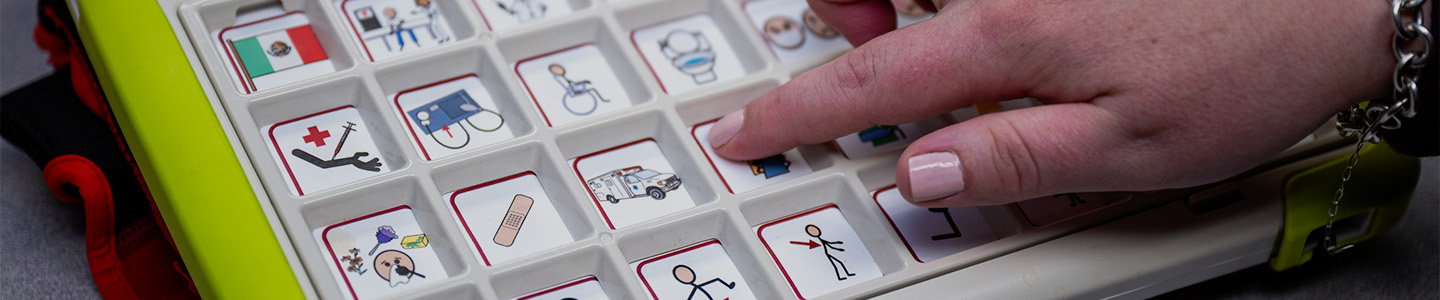 A student prepares to press a button on an auditory testing device