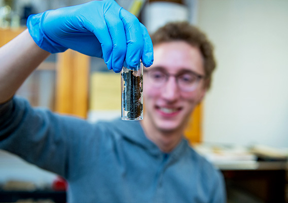 Environmental Science student conducting an experiment in a lab