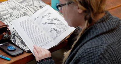 English student reading a book by Aldo Leopold