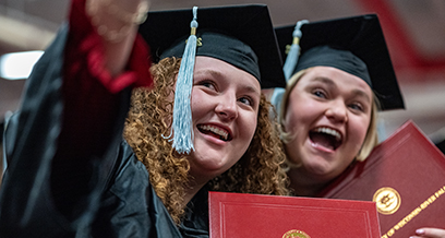 Students taking selfie at Commencement