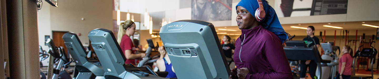 Student running on a treadmill in the Falcon Center