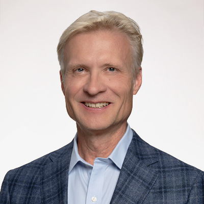 Headshot of Jeff Lamie, a man with short blonde hair wearing a light blue button down and dark blue blazer