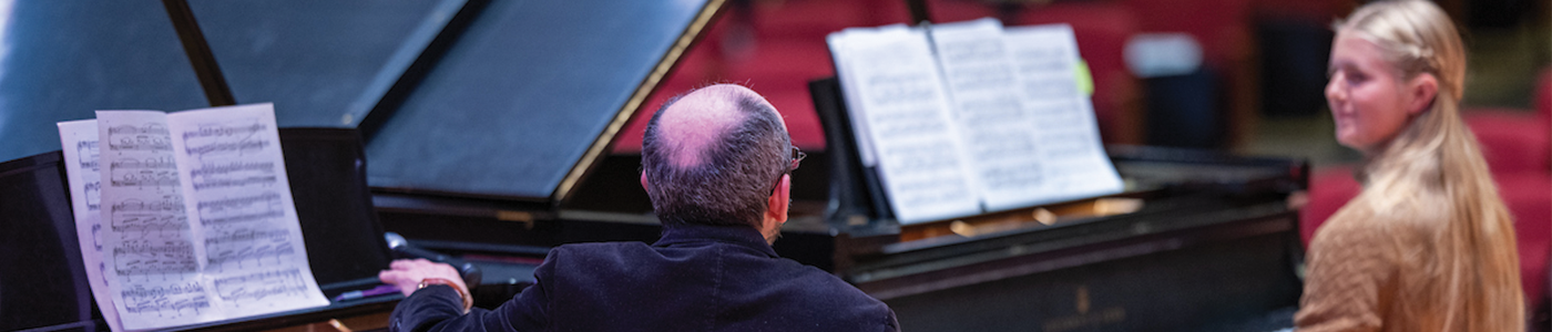 guest artist meeting with student for master class in piano