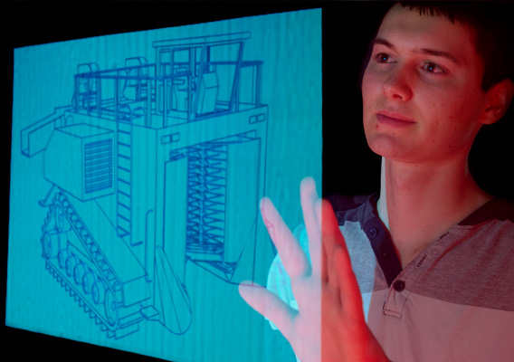 Agricultural Education student views a drawing of a tractor