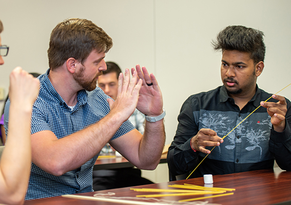 Students working together on an activity in an MBA class