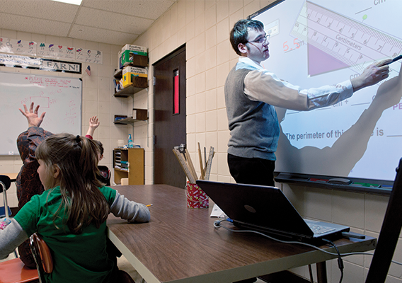 teacher at front of class discussing angles and mathematics