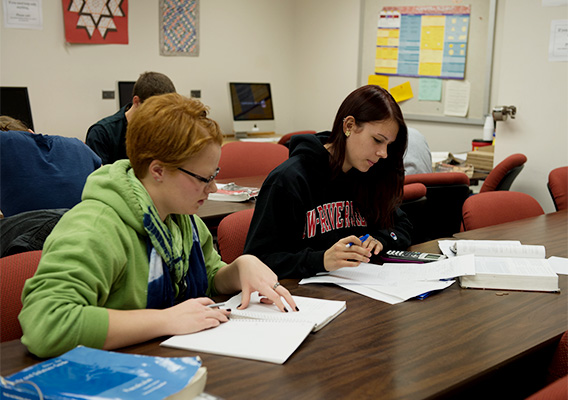 Two students attend a math tutoring session