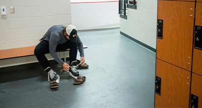Student laces up their ice skates