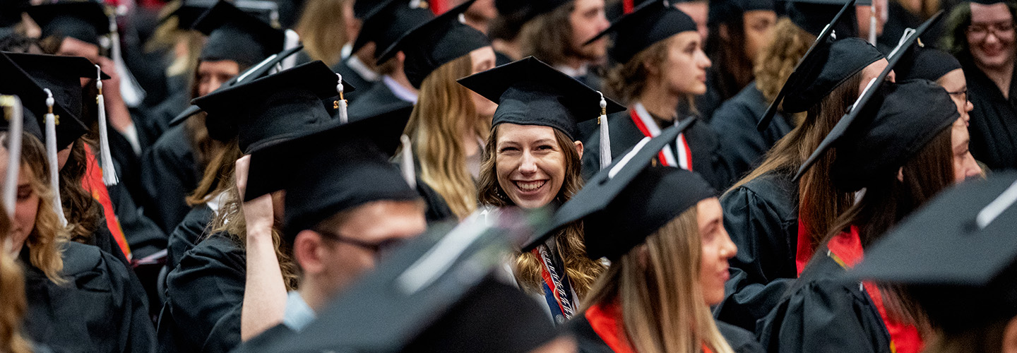 Graduates wearing their graduation caps at commencement