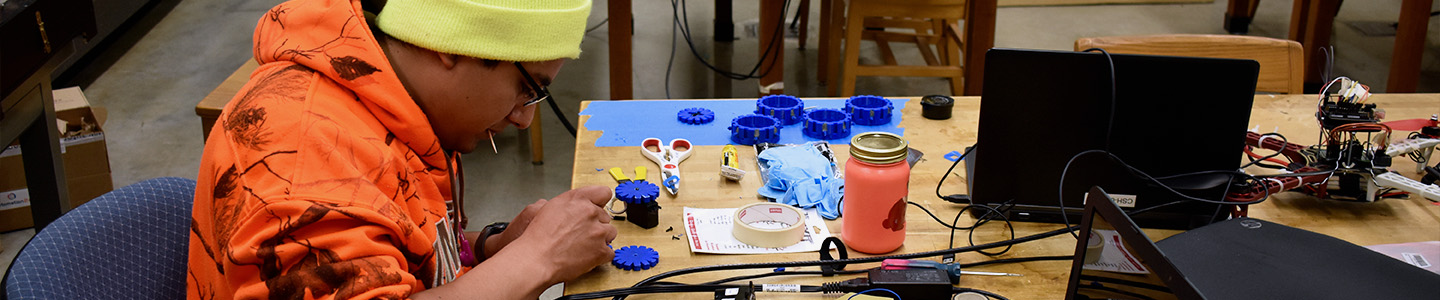 A student working on a project in a physics lab