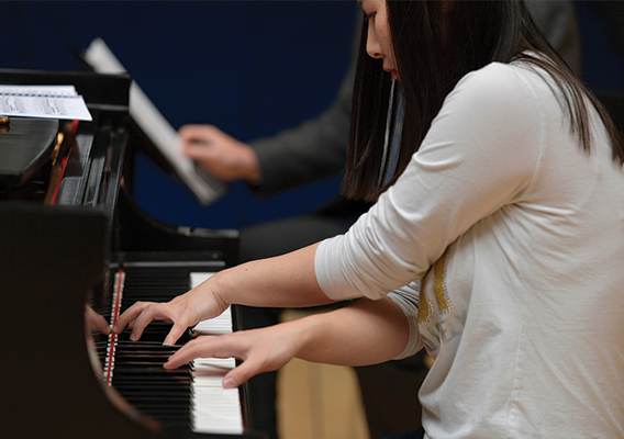 woman playing the piano