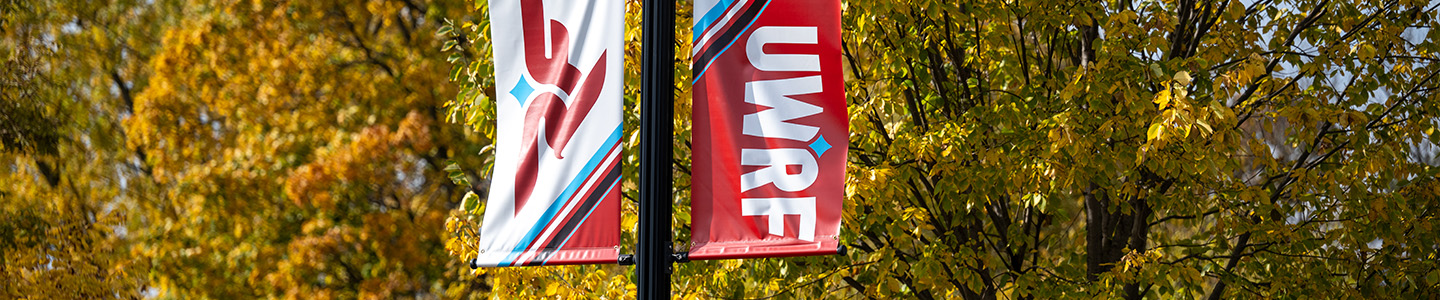 The UWRF lightpost banner in the fall